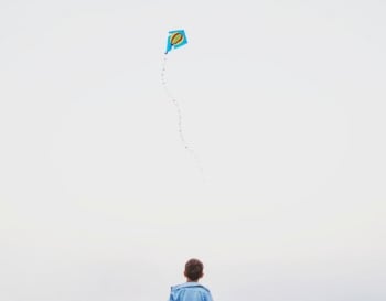boy lying kite