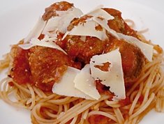 Golf balls with pasta and tomato sauce