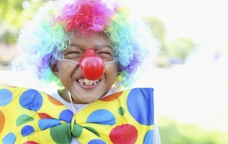 Little kid smiling clown