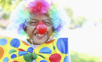 Little kid smiling clown