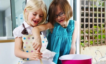 two girls making playdough