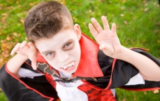 Boy dressed as Dracula