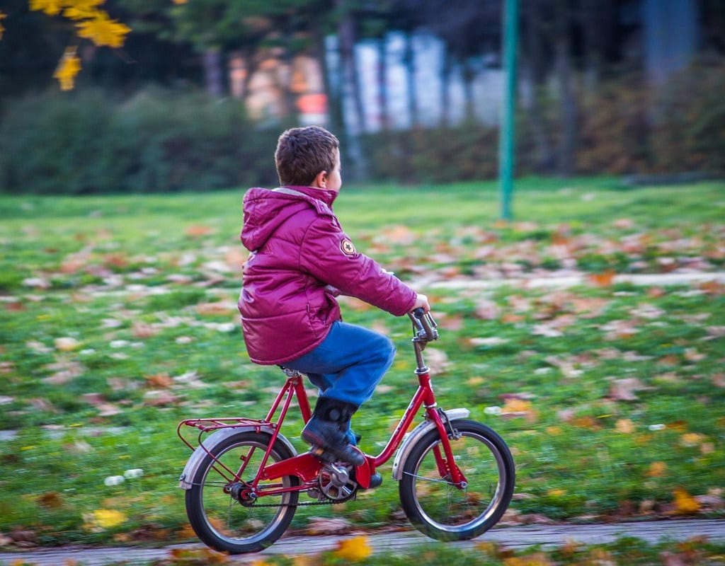 kid learning to ride a bike