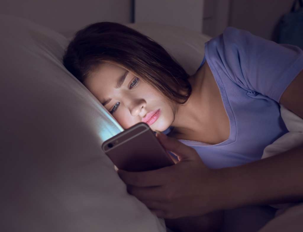 It’s almost impossible to keep teens off their phones in bed – but new research shows it really does affect their sleep