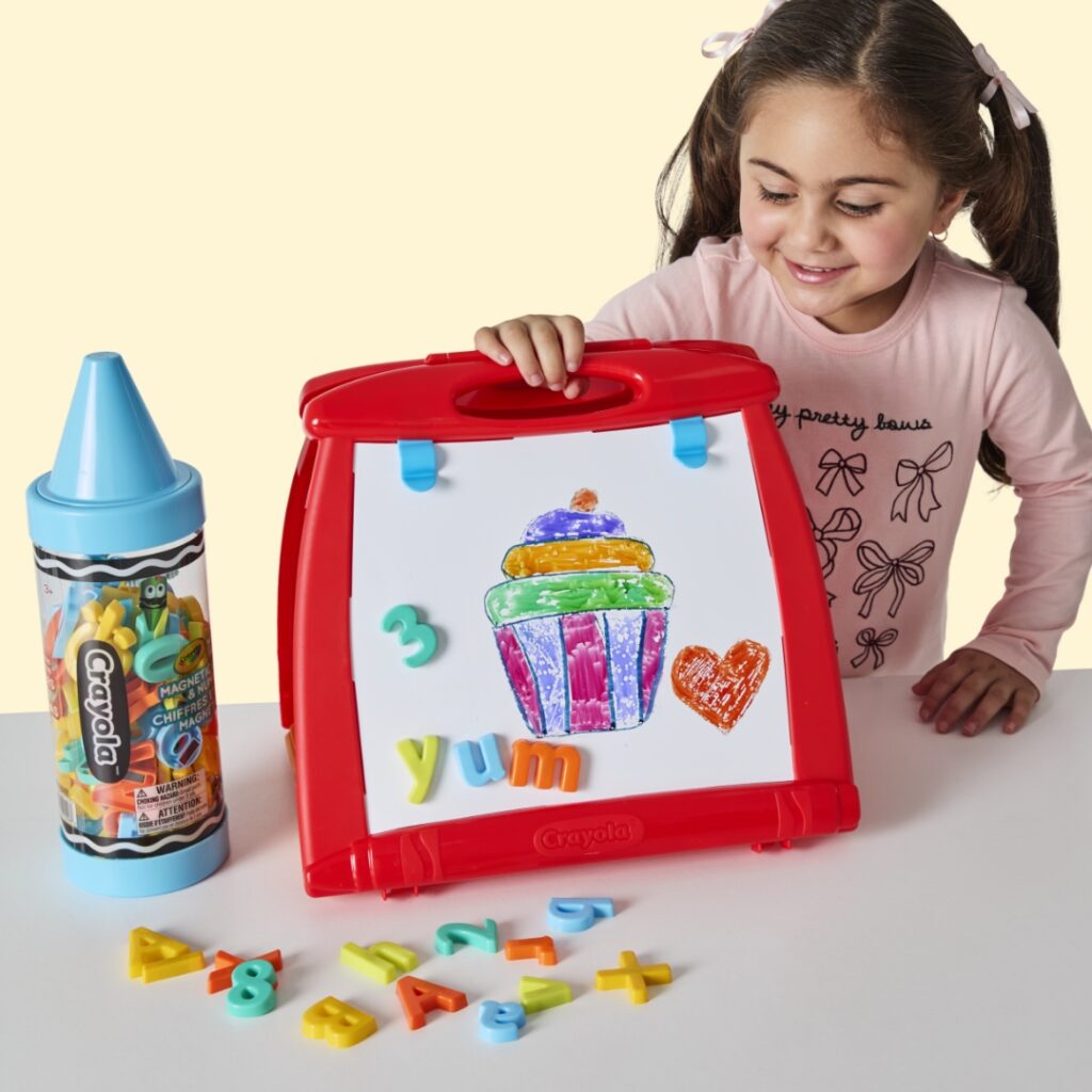 Child playing with an Easel.