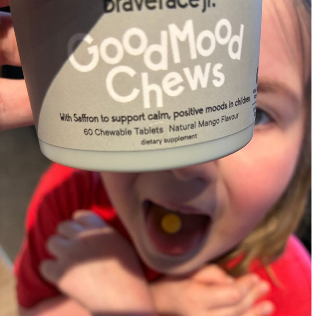 Young child eating a good mood chew.