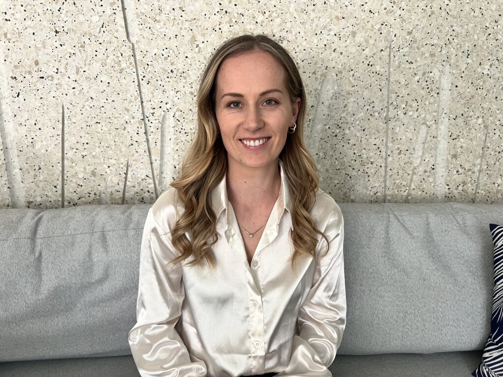 Emma Hawke, founder of Trio Teeth, smiling at the camera.