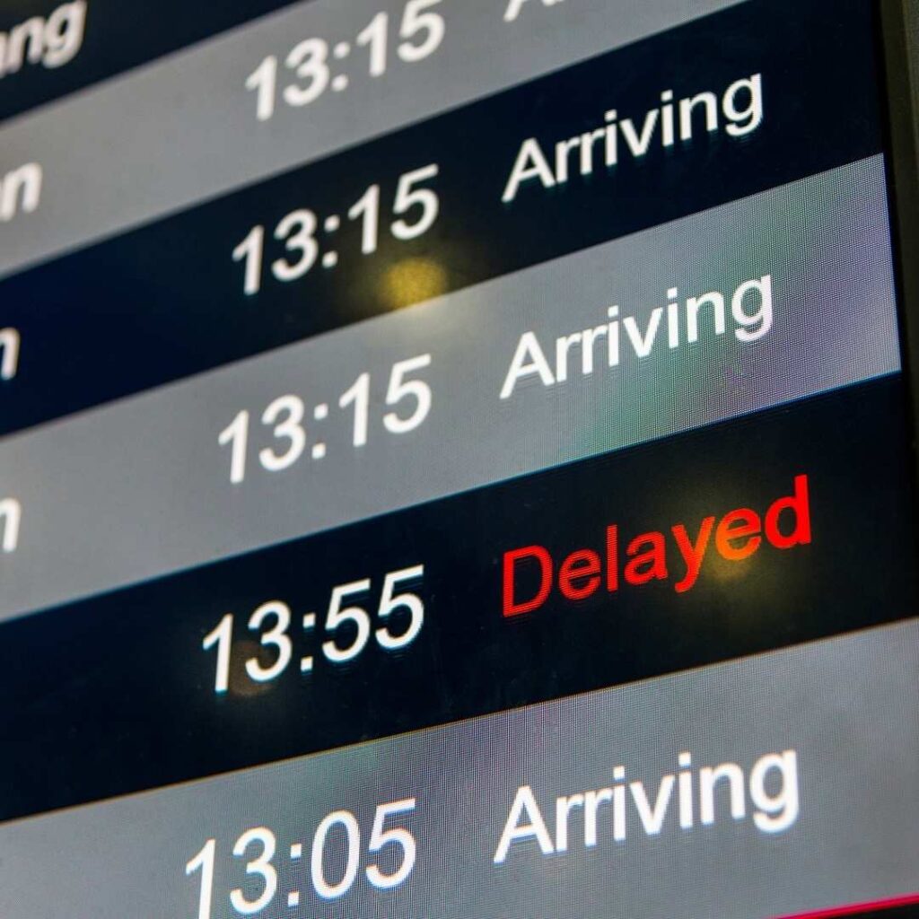 Airport display screen with a delay message. 